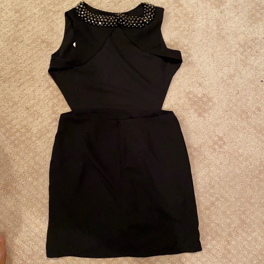 Black backless cocktail dress with beads.